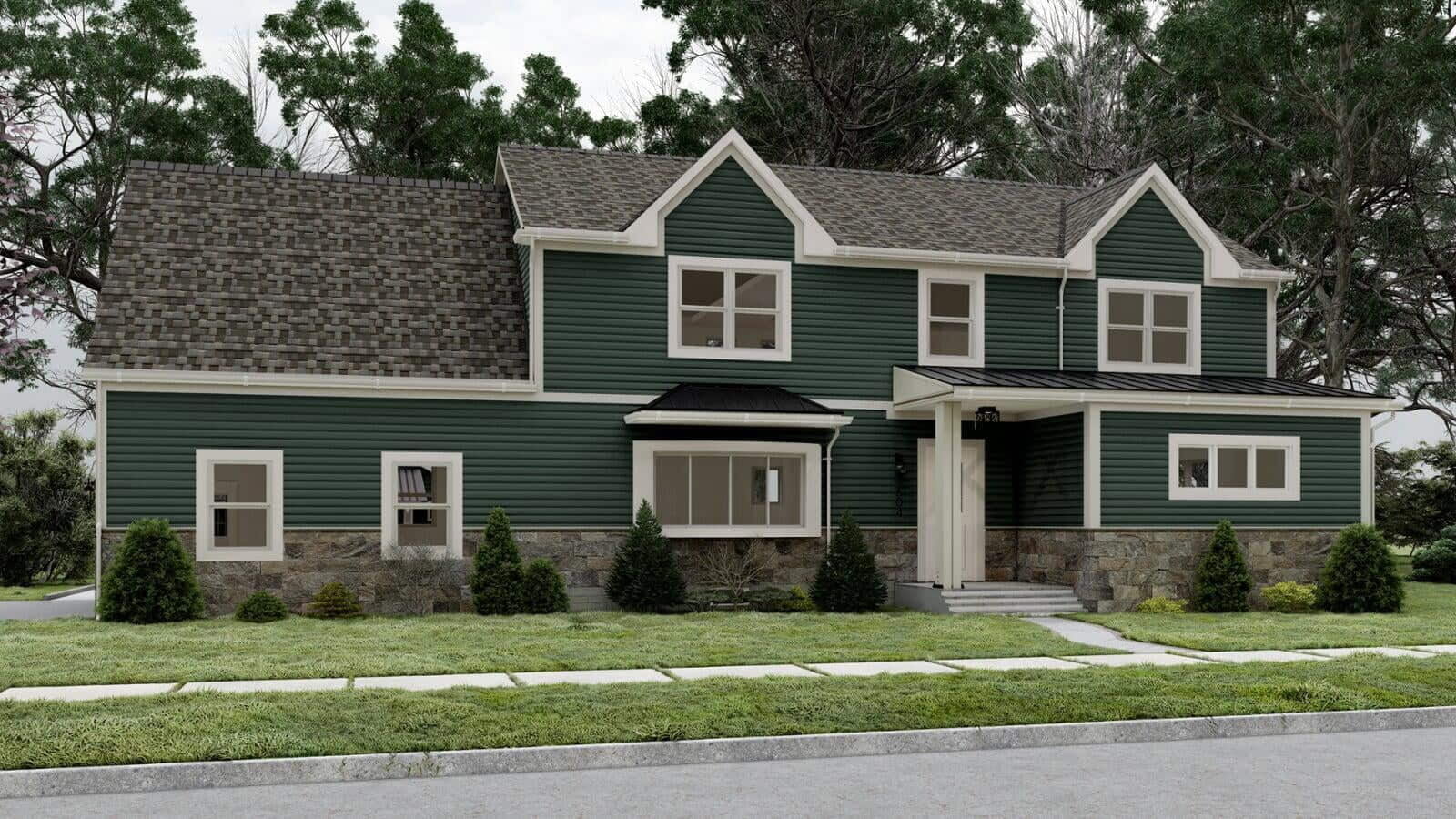 Green two-story modular home with white trim and a dark gray roof, set among trees with a neatly maintained front yard and a welcoming porch.