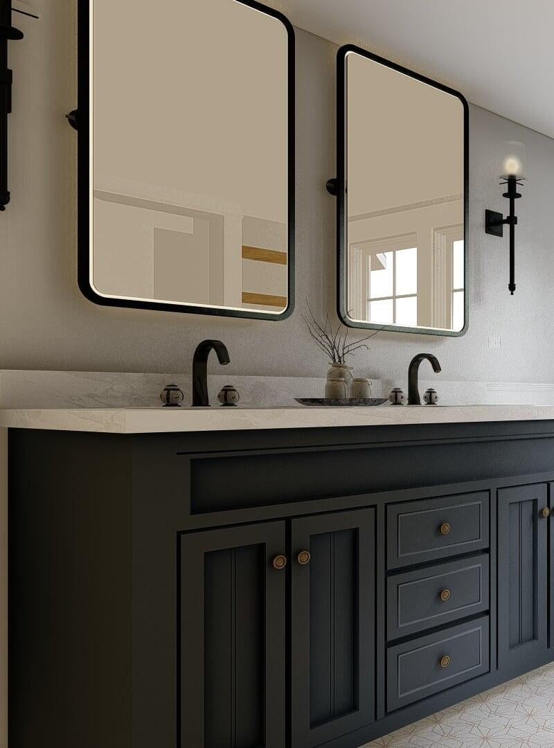 Modern bathroom design featuring a charcoal gray vanity with brass handles and a white marble countertop. Above the vanity are two rectangular mirrors with rounded corners and black frames, flanked by black industrial-style wall sconces. The background includes a soft gray wall and a small vase with greenery on the countertop, adding a touch of nature to the elegant space.